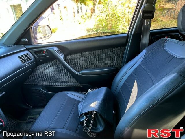 Зеленый Тойота Карина, объемом двигателя 2 л и пробегом 417 тыс. км за 2000 $, фото 6 на Automoto.ua