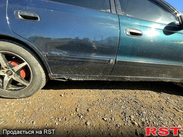 Зеленый Тойота Карина, объемом двигателя 2 л и пробегом 417 тыс. км за 2000 $, фото 1 на Automoto.ua