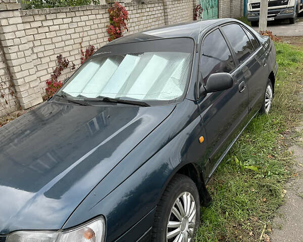 Зеленый Тойота Карина, объемом двигателя 2 л и пробегом 500 тыс. км за 1500 $, фото 2 на Automoto.ua