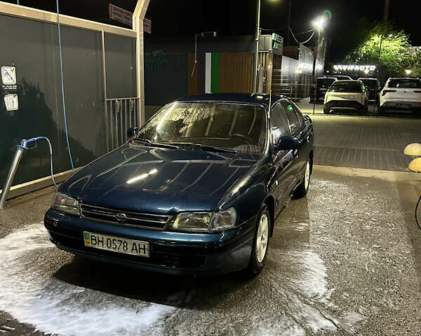 Зеленый Тойота Карина, объемом двигателя 1.6 л и пробегом 470 тыс. км за 2000 $, фото 1 на Automoto.ua