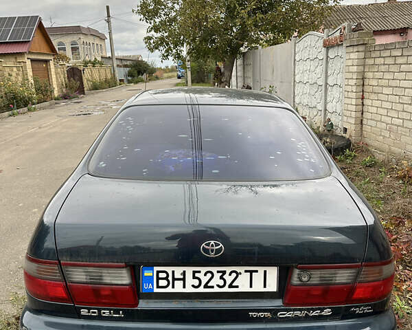 Зеленый Тойота Карина, объемом двигателя 2 л и пробегом 500 тыс. км за 1500 $, фото 1 на Automoto.ua