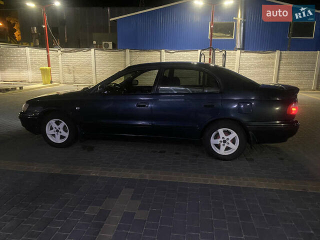 Зеленый Тойота Карина, объемом двигателя 1.6 л и пробегом 470 тыс. км за 2000 $, фото 2 на Automoto.ua