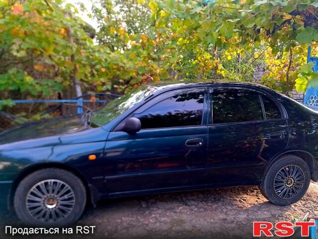 Зелений Тойота Каріна, об'ємом двигуна 1.6 л та пробігом 438 тис. км за 2000 $, фото 5 на Automoto.ua