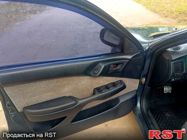 Зелений Тойота Каріна, об'ємом двигуна 1.6 л та пробігом 400 тис. км за 2000 $, фото 8 на Automoto.ua