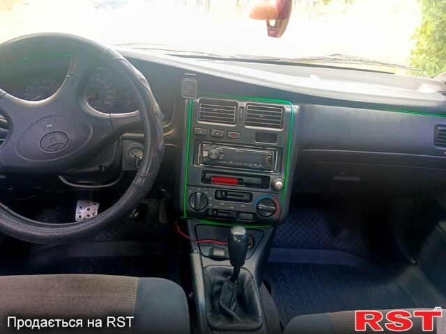 Зелений Тойота Каріна, об'ємом двигуна 1.6 л та пробігом 400 тис. км за 2000 $, фото 10 на Automoto.ua