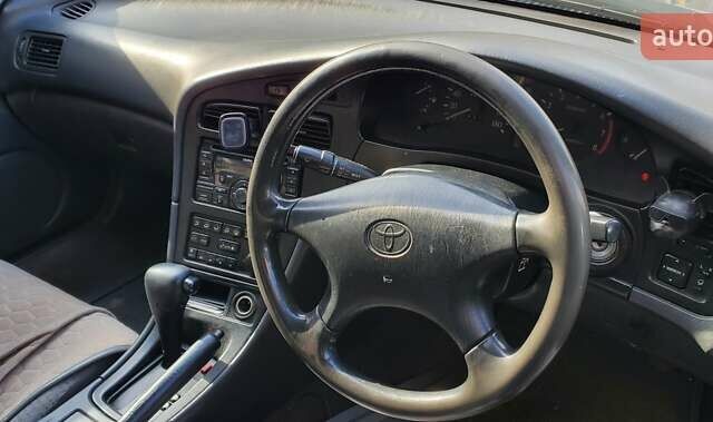 Зеленый Тойота Карина, объемом двигателя 2 л и пробегом 450 тыс. км за 3500 $, фото 2 на Automoto.ua