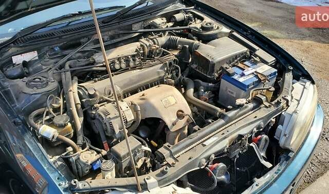 Зеленый Тойота Карина, объемом двигателя 2 л и пробегом 450 тыс. км за 3500 $, фото 1 на Automoto.ua