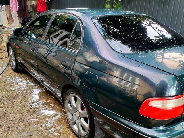 Зеленый Тойота Карина, объемом двигателя 2 л и пробегом 525 тыс. км за 2400 $, фото 1 на Automoto.ua