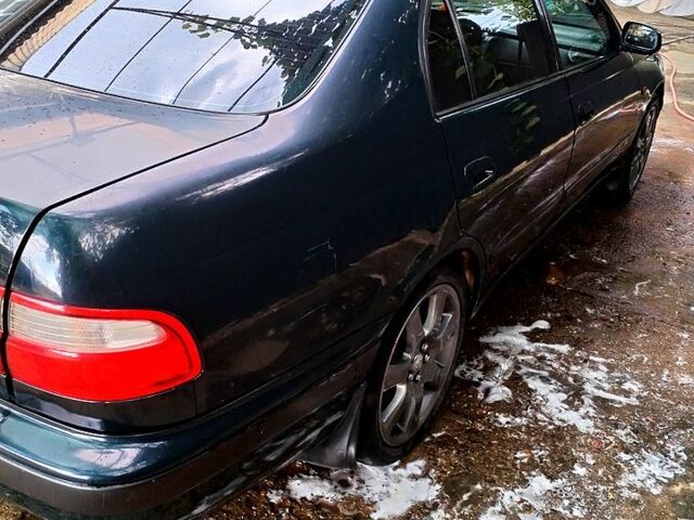 Зеленый Тойота Карина, объемом двигателя 2 л и пробегом 525 тыс. км за 2400 $, фото 3 на Automoto.ua