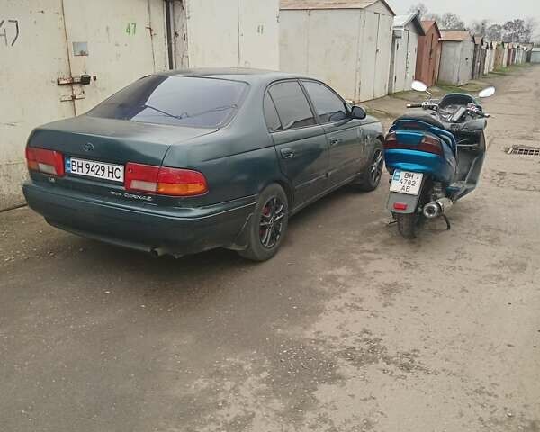 Зелений Тойота Каріна, об'ємом двигуна 1.76 л та пробігом 345 тис. км за 3500 $, фото 1 на Automoto.ua