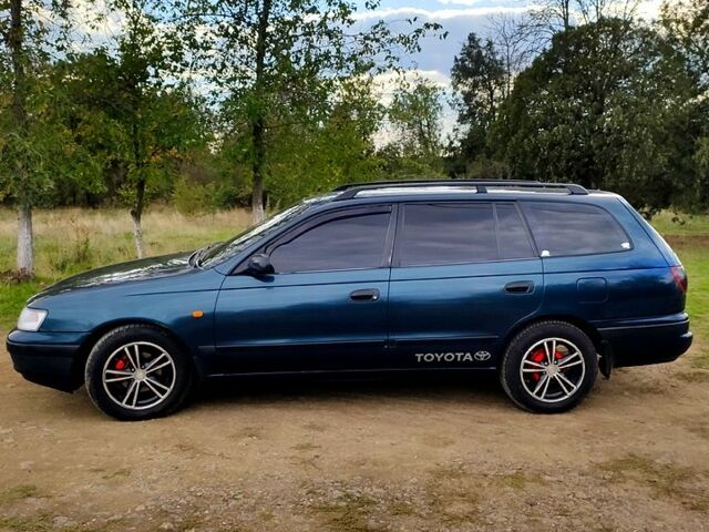 Зеленый Тойота Карина, объемом двигателя 2 л и пробегом 380 тыс. км за 3700 $, фото 1 на Automoto.ua