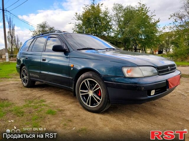 Зеленый Тойота Карина, объемом двигателя 2 л и пробегом 380 тыс. км за 3700 $, фото 6 на Automoto.ua