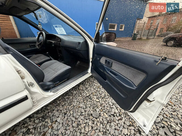 Белый Тойота Королла, объемом двигателя 1.3 л и пробегом 350 тыс. км за 1200 $, фото 19 на Automoto.ua