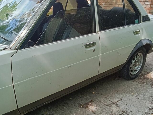 Белый Тойота Королла, объемом двигателя 1.3 л и пробегом 238 тыс. км за 595 $, фото 4 на Automoto.ua