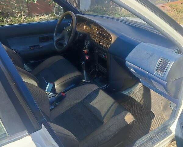 Белый Тойота Королла, объемом двигателя 1.59 л и пробегом 400 тыс. км за 800 $, фото 3 на Automoto.ua