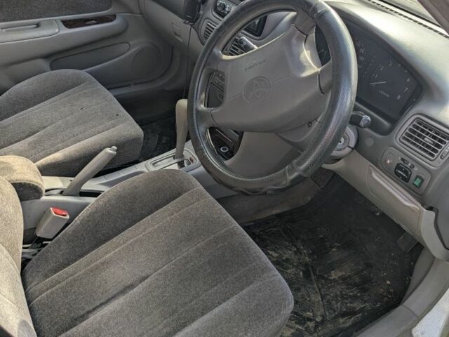 Белый Тойота Королла, объемом двигателя 1.5 л и пробегом 150 тыс. км за 2000 $, фото 2 на Automoto.ua