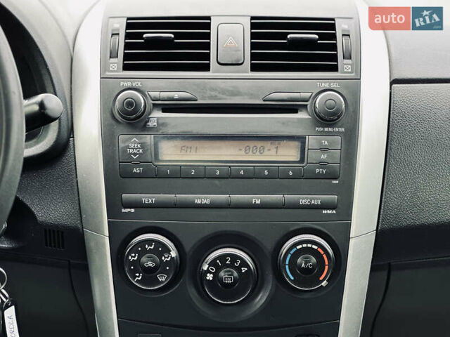 Білий Тойота Королла, об'ємом двигуна 1.33 л та пробігом 243 тис. км за 7399 $, фото 26 на Automoto.ua