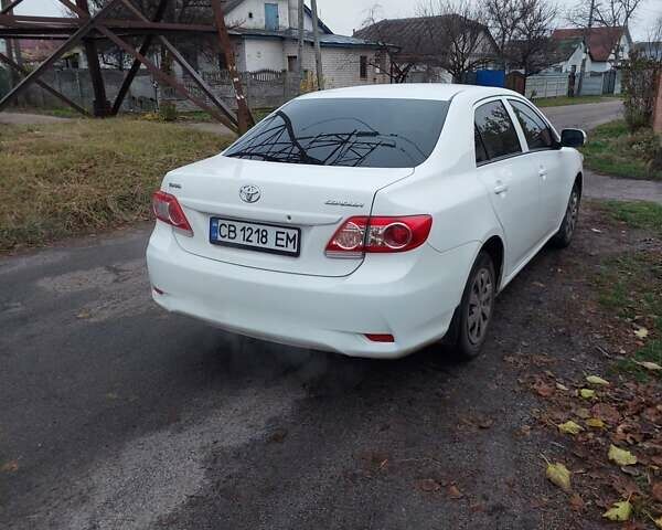 Білий Тойота Королла, об'ємом двигуна 1.33 л та пробігом 96 тис. км за 9800 $, фото 4 на Automoto.ua