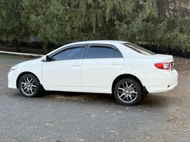 Белый Тойота Королла, объемом двигателя 1.6 л и пробегом 93 тыс. км за 10500 $, фото 5 на Automoto.ua