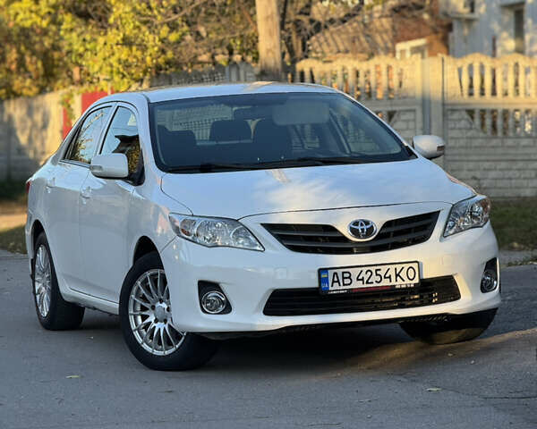 Белый Тойота Королла, объемом двигателя 1.33 л и пробегом 220 тыс. км за 6500 $, фото 1 на Automoto.ua