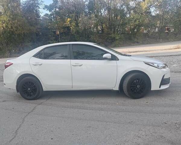 Білий Тойота Королла, об'ємом двигуна 1.6 л та пробігом 203 тис. км за 10000 $, фото 16 на Automoto.ua