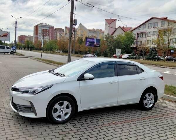 Білий Тойота Королла, об'ємом двигуна 1.6 л та пробігом 77 тис. км за 14000 $, фото 12 на Automoto.ua