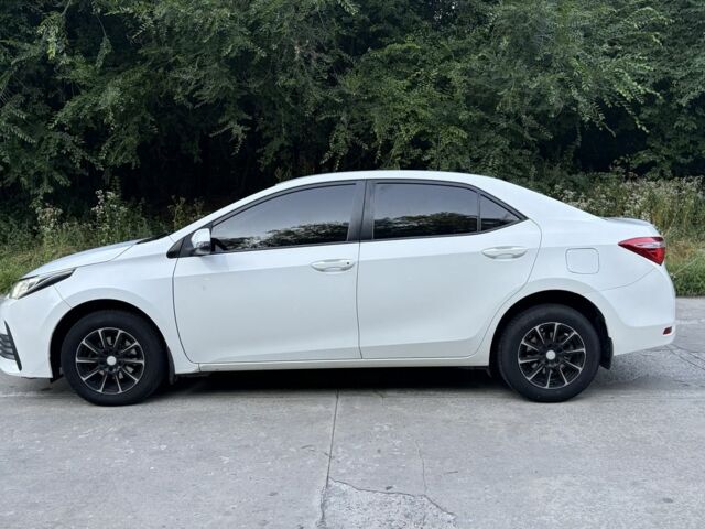 Білий Тойота Королла, об'ємом двигуна 1.3 л та пробігом 121 тис. км за 11467 $, фото 6 на Automoto.ua