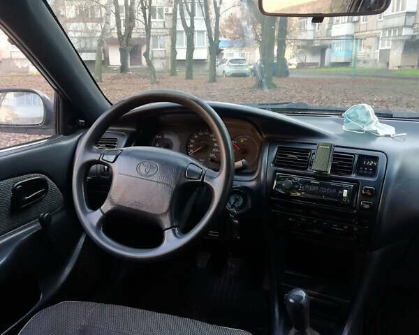 Белый Тойота Королла, объемом двигателя 1.3 л и пробегом 400 тыс. км за 2000 $, фото 26 на Automoto.ua