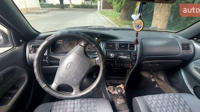 Черный Тойота Королла, объемом двигателя 1.33 л и пробегом 278 тыс. км за 2200 $, фото 7 на Automoto.ua