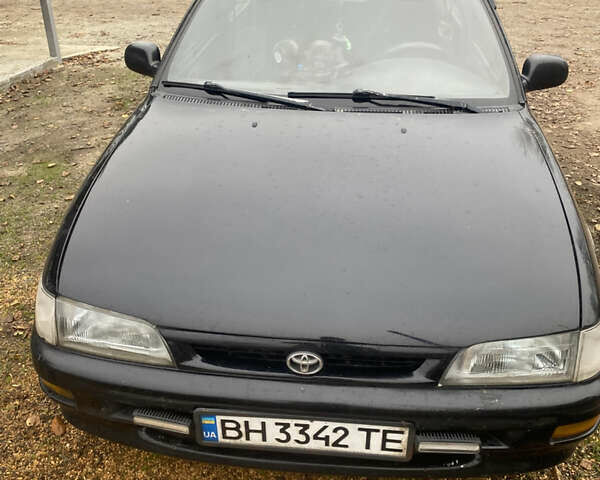 Черный Тойота Королла, объемом двигателя 1.33 л и пробегом 320 тыс. км за 2500 $, фото 1 на Automoto.ua