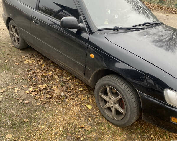 Черный Тойота Королла, объемом двигателя 1.33 л и пробегом 320 тыс. км за 2500 $, фото 4 на Automoto.ua