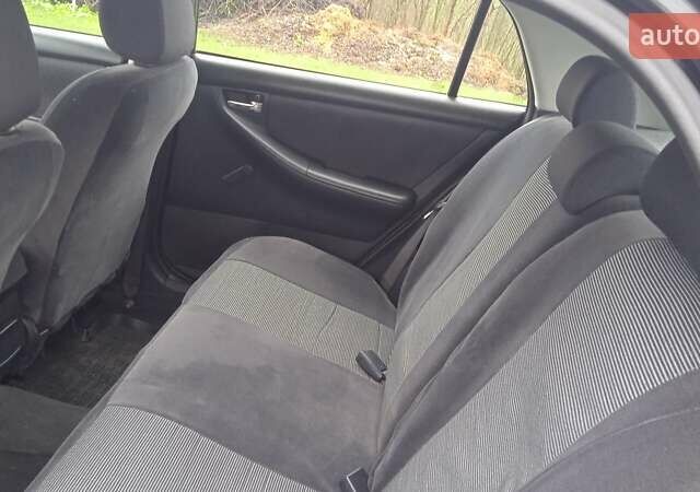 Черный Тойота Королла, объемом двигателя 2 л и пробегом 330 тыс. км за 3600 $, фото 6 на Automoto.ua