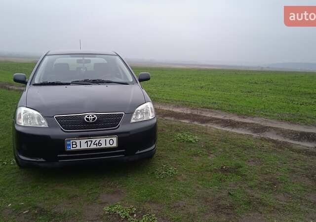 Черный Тойота Королла, объемом двигателя 2 л и пробегом 330 тыс. км за 3600 $, фото 1 на Automoto.ua