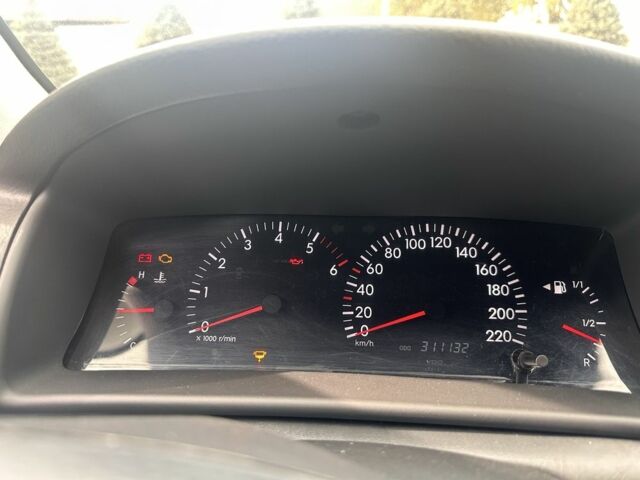 Чорний Тойота Королла, об'ємом двигуна 2 л та пробігом 311 тис. км за 3300 $, фото 4 на Automoto.ua