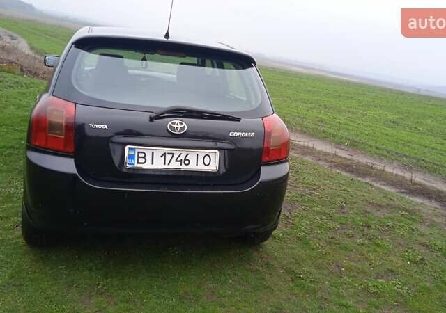 Черный Тойота Королла, объемом двигателя 2 л и пробегом 330 тыс. км за 3600 $, фото 2 на Automoto.ua