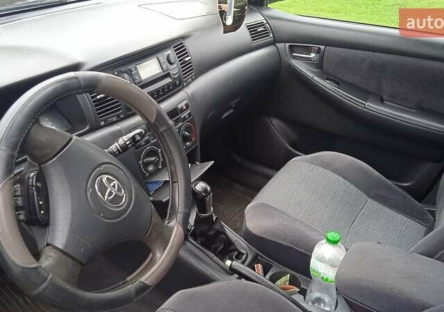 Черный Тойота Королла, объемом двигателя 2 л и пробегом 330 тыс. км за 3600 $, фото 7 на Automoto.ua