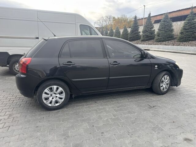 Чорний Тойота Королла, об'ємом двигуна 2 л та пробігом 311 тис. км за 3300 $, фото 1 на Automoto.ua