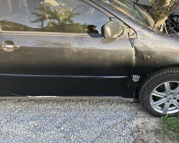 Черный Тойота Королла, объемом двигателя 1.4 л и пробегом 345 тыс. км за 1895 $, фото 5 на Automoto.ua