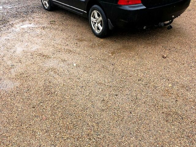 Черный Тойота Королла, объемом двигателя 1.6 л и пробегом 265 тыс. км за 3900 $, фото 2 на Automoto.ua