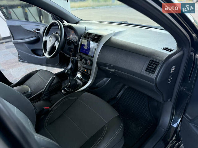 Чорний Тойота Королла, об'ємом двигуна 1.6 л та пробігом 221 тис. км за 6799 $, фото 4 на Automoto.ua