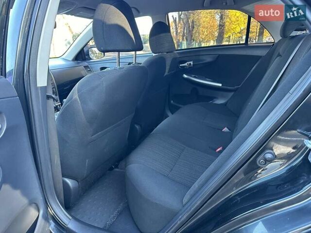 Чорний Тойота Королла, об'ємом двигуна 1.6 л та пробігом 193 тис. км за 5999 $, фото 13 на Automoto.ua