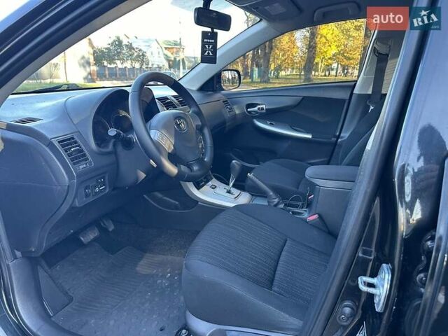 Чорний Тойота Королла, об'ємом двигуна 1.6 л та пробігом 193 тис. км за 5999 $, фото 24 на Automoto.ua