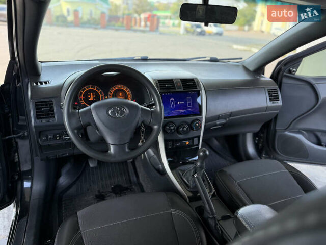 Чорний Тойота Королла, об'ємом двигуна 1.6 л та пробігом 221 тис. км за 6799 $, фото 5 на Automoto.ua