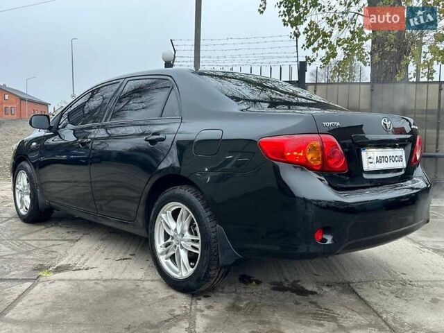 Чорний Тойота Королла, об'ємом двигуна 1.6 л та пробігом 316 тис. км за 7490 $, фото 6 на Automoto.ua