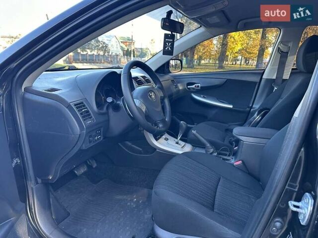 Чорний Тойота Королла, об'ємом двигуна 1.6 л та пробігом 193 тис. км за 5999 $, фото 23 на Automoto.ua