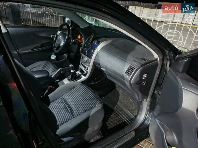 Чорний Тойота Королла, об'ємом двигуна 1.6 л та пробігом 207 тис. км за 6900 $, фото 16 на Automoto.ua