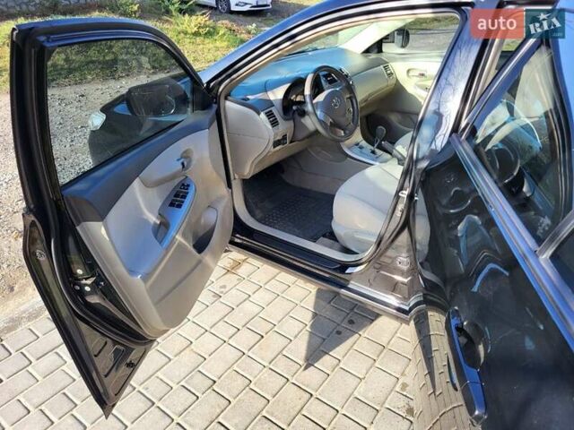 Чорний Тойота Королла, об'ємом двигуна 1.6 л та пробігом 195 тис. км за 8500 $, фото 11 на Automoto.ua