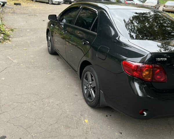 Чорний Тойота Королла, об'ємом двигуна 1.6 л та пробігом 147 тис. км за 7700 $, фото 4 на Automoto.ua