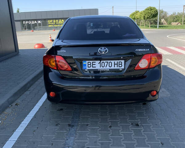 Чорний Тойота Королла, об'ємом двигуна 1.6 л та пробігом 223 тис. км за 7000 $, фото 5 на Automoto.ua