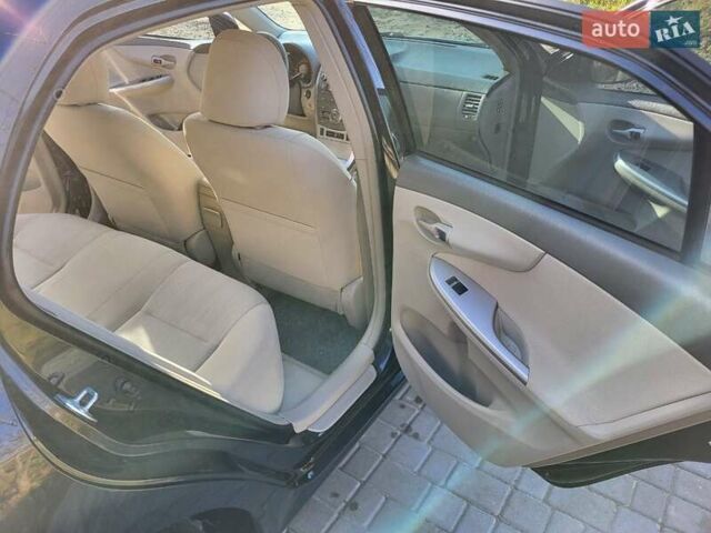 Чорний Тойота Королла, об'ємом двигуна 1.6 л та пробігом 195 тис. км за 8500 $, фото 6 на Automoto.ua